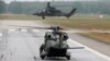 Germany -- A German Bundeswehr armed forces NH 90 helicopter (bottom) and a Tiger attack helicopter are seen during a drill for the upcoming ILA Berlin Air Show at Holzdorf Air Base, south of Berlin, May 25, 2016