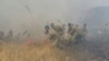 Kazakhstan -- Extinguishing fire in the steppe. The photo was provided by the press service of the Emergency Situations Committee of the Ministry of Internal Affairs of Kazakhstan.